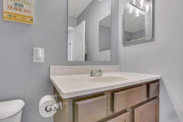 bathroom with vanity and toilet