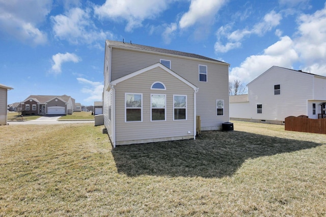 back of property featuring a lawn