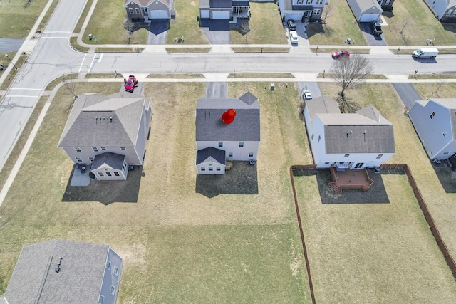 birds eye view of property with a residential view