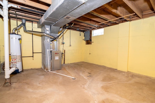 basement with heating unit, electric panel, visible vents, and gas water heater