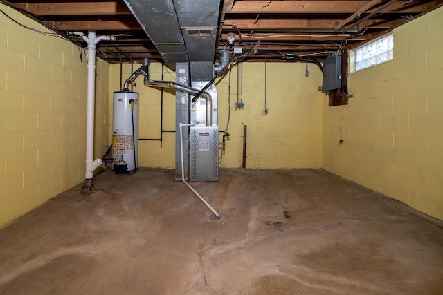 below grade area featuring visible vents, gas water heater, electric panel, and heating unit