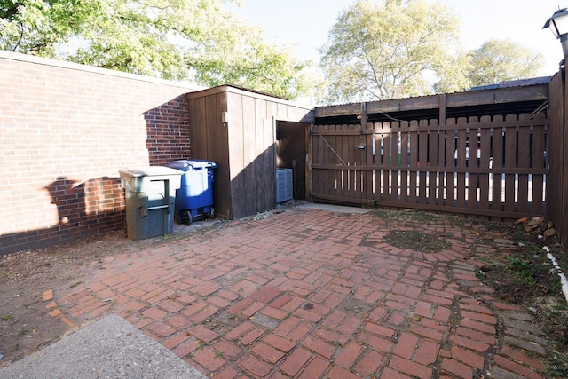 view of patio featuring a gate and fence