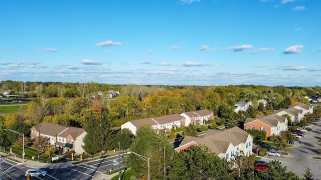 aerial view featuring a residential view and a view of trees