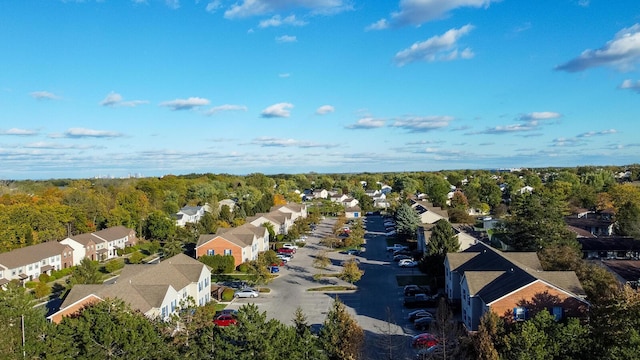 aerial view featuring a residential view and a wooded view