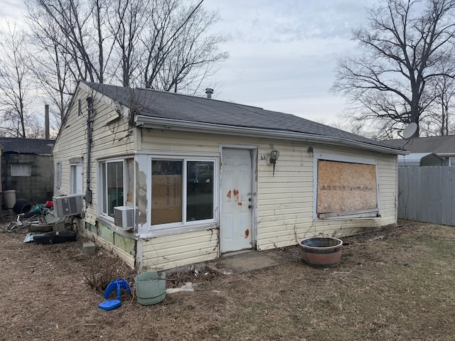 back of house with fence and cooling unit