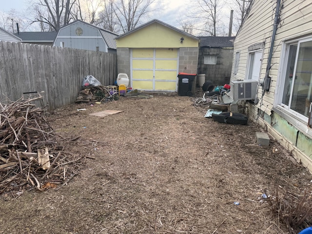 view of yard with an outbuilding and fence