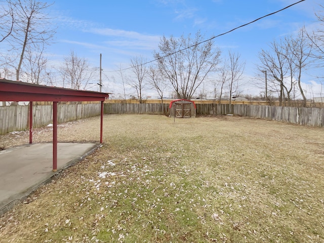 view of yard with a fenced backyard and a patio