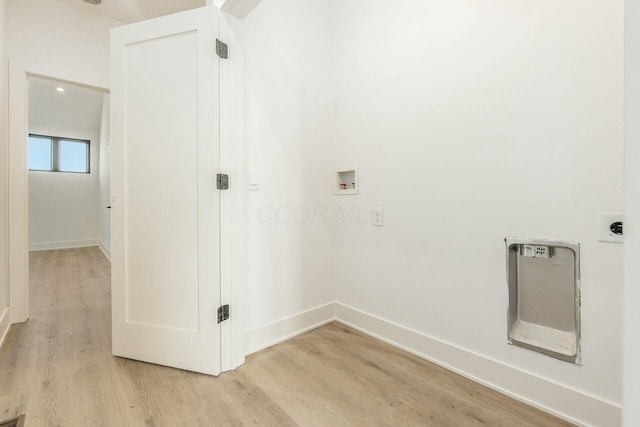 laundry area featuring hookup for a washing machine, laundry area, baseboards, light wood-style floors, and electric dryer hookup