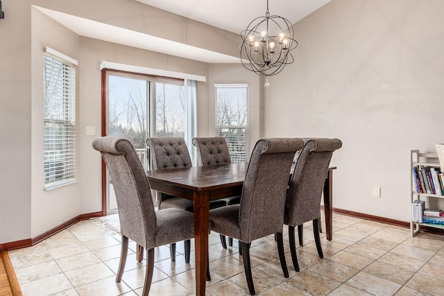 dining space with a chandelier, baseboards, and light tile patterned floors