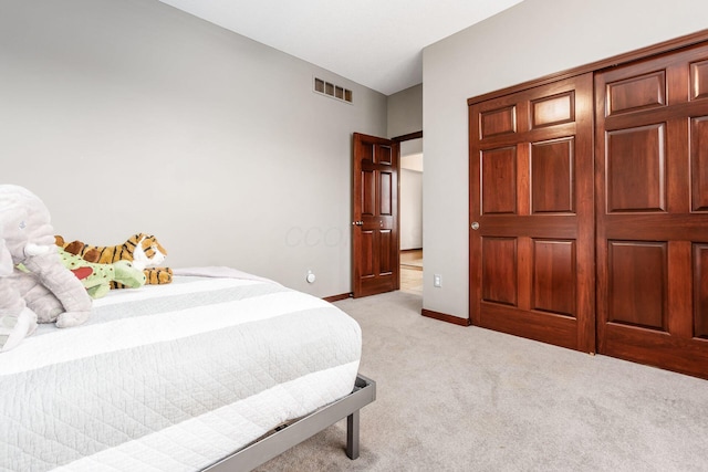 bedroom with light carpet, baseboards, and visible vents