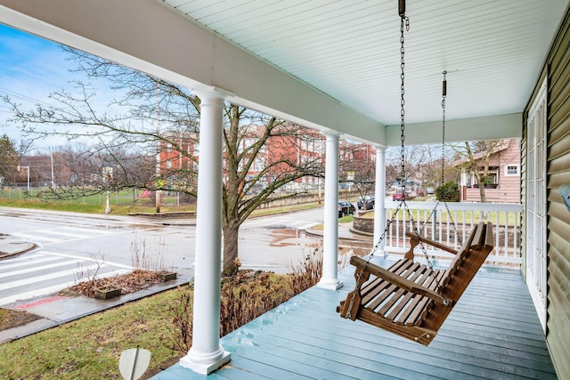 wooden terrace featuring covered porch