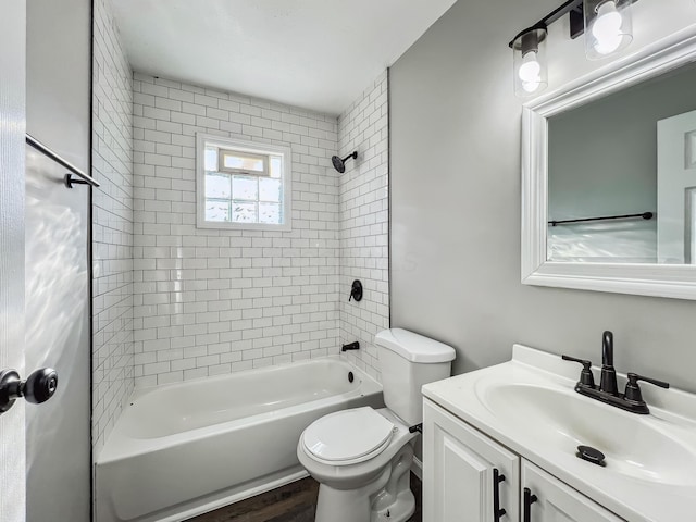 bathroom with toilet, vanity, bathtub / shower combination, and wood finished floors