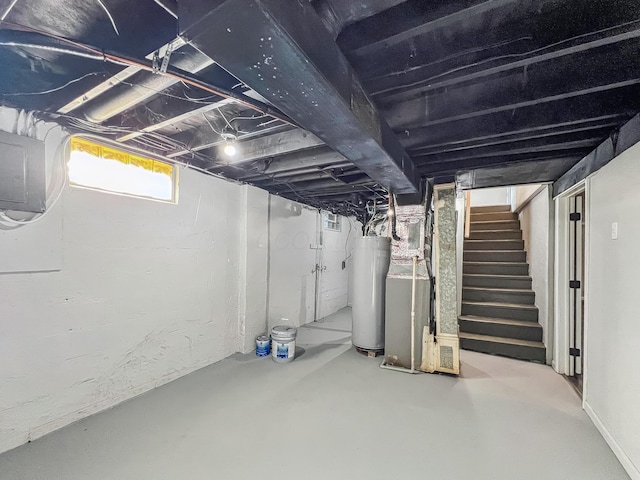 below grade area featuring stairs, gas water heater, and electric panel