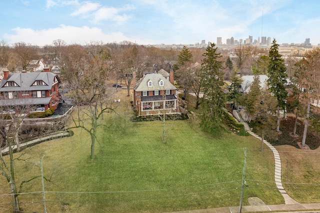 birds eye view of property with a view of city