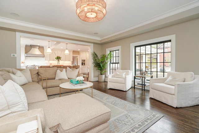 living room featuring ornamental molding, dark wood finished floors, and baseboards