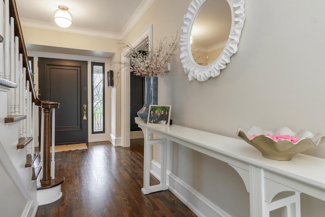 entryway featuring dark wood finished floors, crown molding, stairway, and baseboards