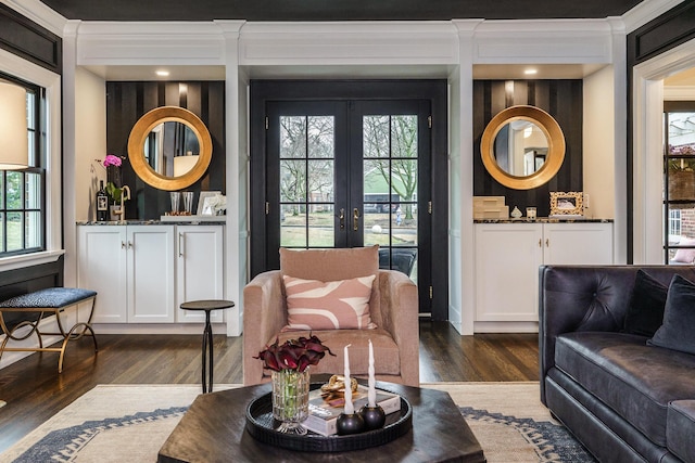 living area featuring french doors and dark wood finished floors