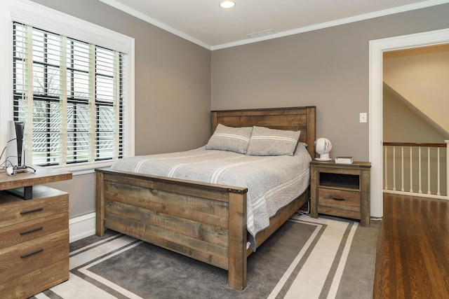 bedroom featuring light colored carpet, recessed lighting, visible vents, and crown molding