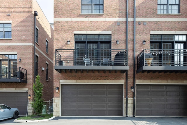 37 W Whittier St, Columbus, OH 43206 - rear view of property with a garage and brick siding