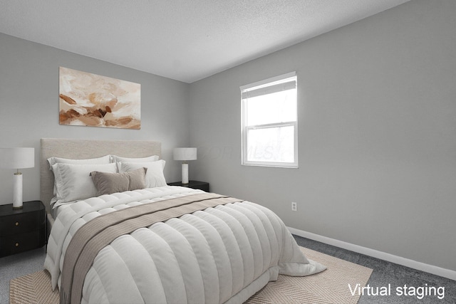 bedroom with carpet floors, a textured ceiling, and baseboards