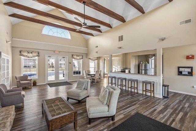 living area with visible vents, dark wood-type flooring, french doors, high vaulted ceiling, and beam ceiling