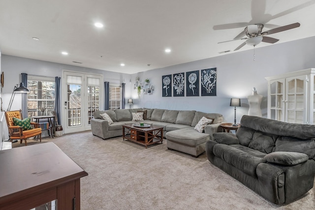 carpeted living area featuring visible vents, a ceiling fan, and recessed lighting