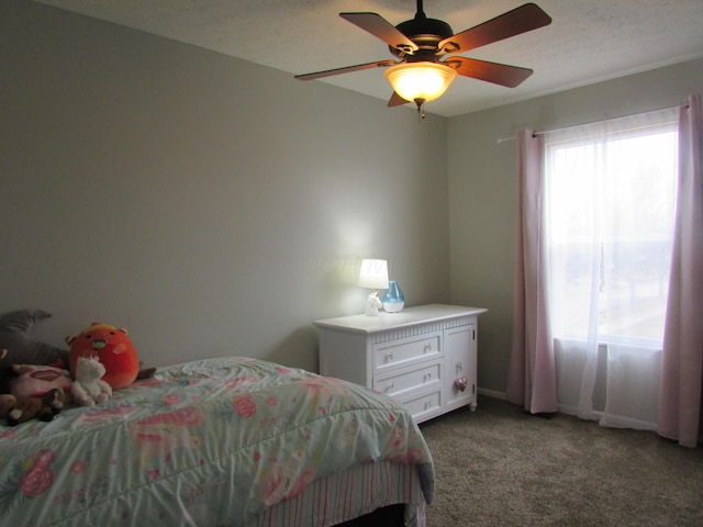 carpeted bedroom featuring a ceiling fan