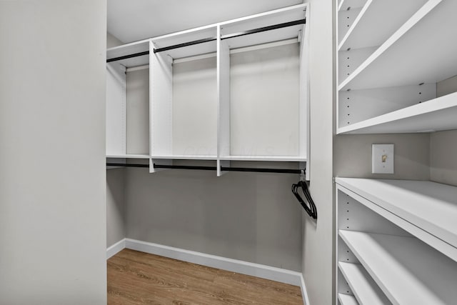 spacious closet with wood finished floors