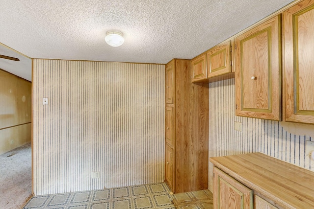 kitchen featuring light countertops and a textured ceiling