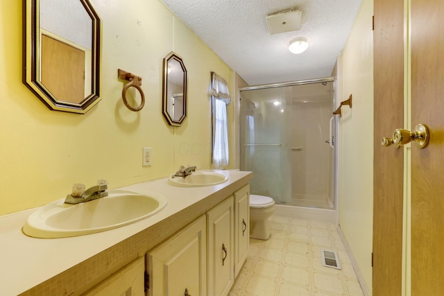 full bathroom with a shower stall, visible vents, a sink, and tile patterned floors