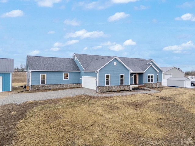 ranch-style house with stone siding, a garage, driveway, and roof with shingles