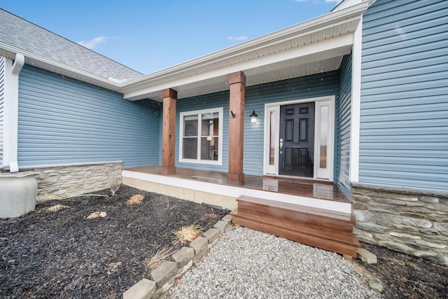 doorway to property with covered porch