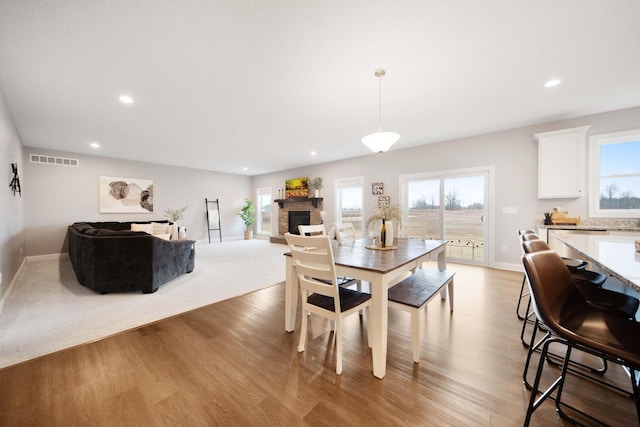 dining space with recessed lighting, light wood-style floors, visible vents, and a wealth of natural light