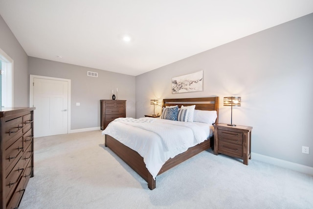 bedroom with visible vents, carpet flooring, and baseboards