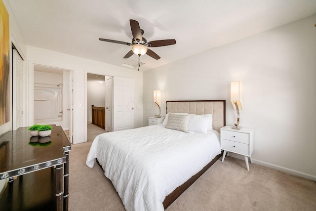 bedroom with a ceiling fan, baseboards, lofted ceiling, a closet, and light colored carpet