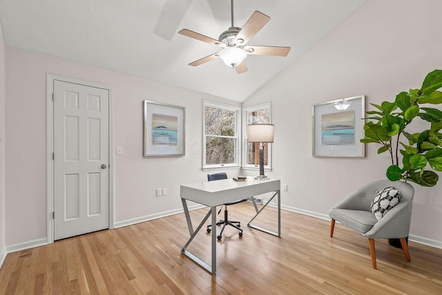 office with lofted ceiling, light wood finished floors, and baseboards