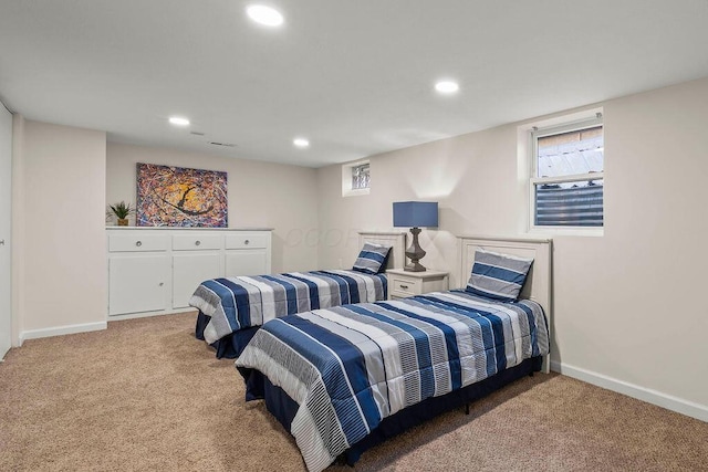 bedroom with baseboards, recessed lighting, and light colored carpet