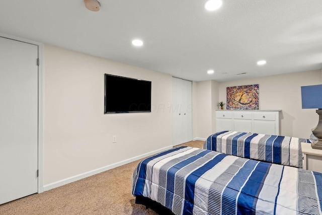 bedroom with recessed lighting, carpet flooring, and baseboards