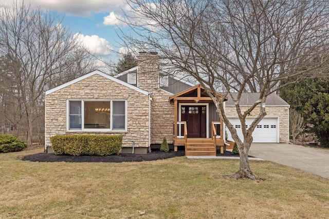 view of front facade with a garage, driveway, a chimney, and a front lawn