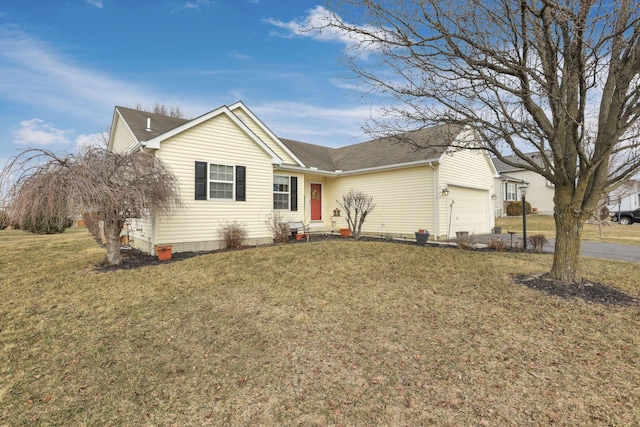 ranch-style home featuring a garage and a front lawn