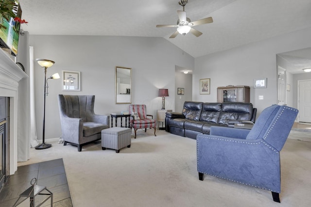 carpeted living area with vaulted ceiling, a fireplace, and ceiling fan