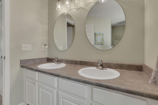 bathroom with double vanity and a sink