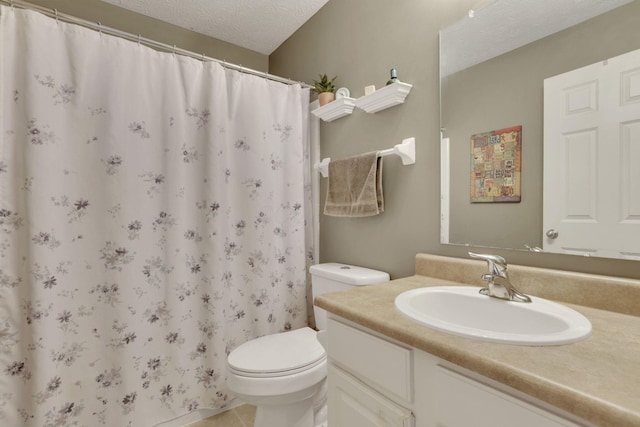 bathroom with toilet, a shower with curtain, a textured ceiling, and vanity