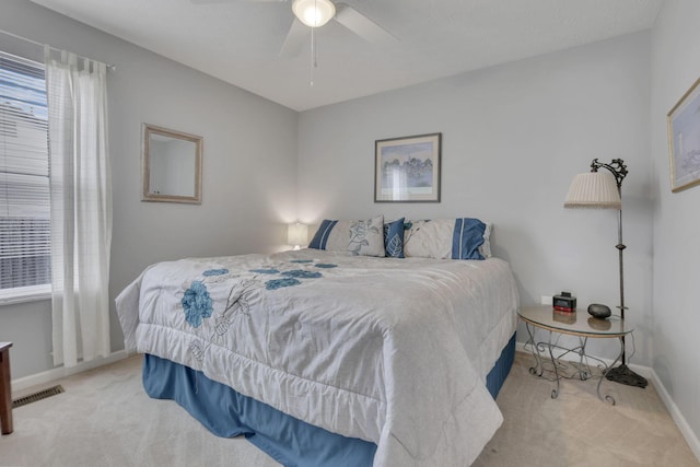 bedroom with multiple windows, carpet, and visible vents