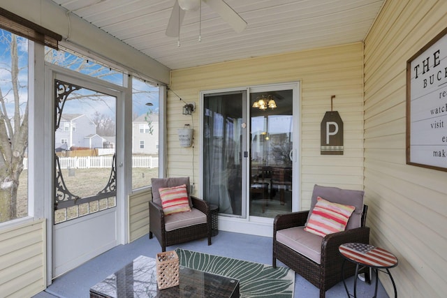 sunroom / solarium with ceiling fan