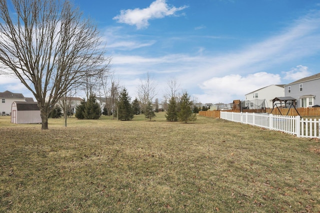 view of yard featuring a residential view and fence