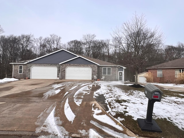 ranch-style house with concrete driveway and an attached garage