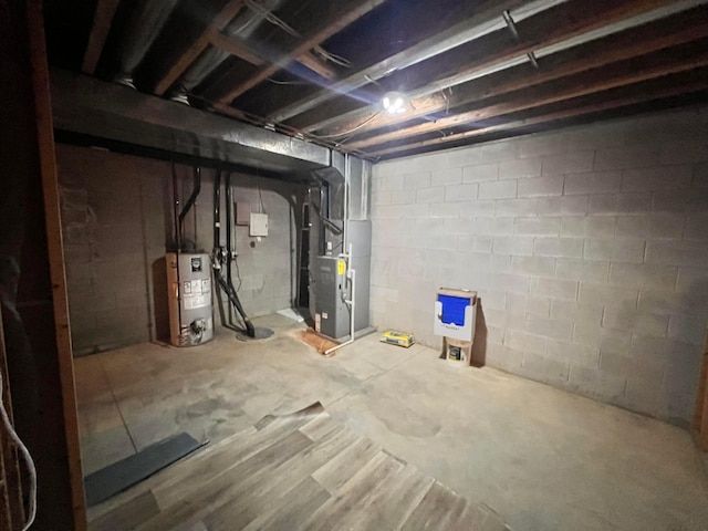 1396 Spring Village Dr, Mansfield, OH 44906 - unfinished below grade area featuring electric water heater and heating unit