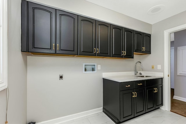 laundry area with cabinet space, washer hookup, marble finish floor, and a sink