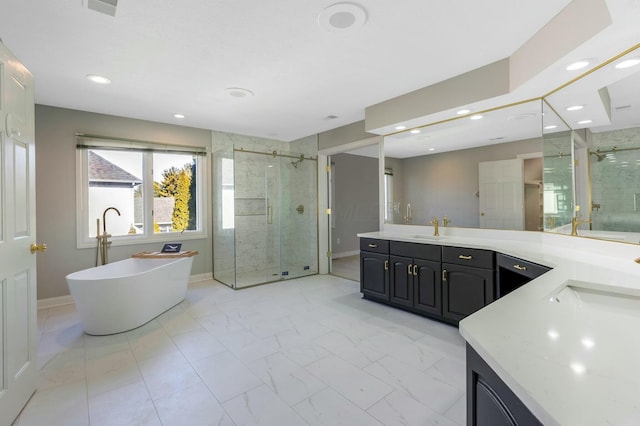 bathroom with baseboards, a freestanding bath, a stall shower, marble finish floor, and vanity